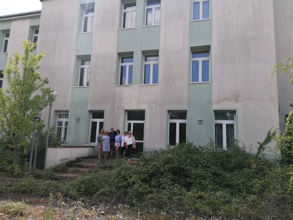 In front of the former infirmary-hospital